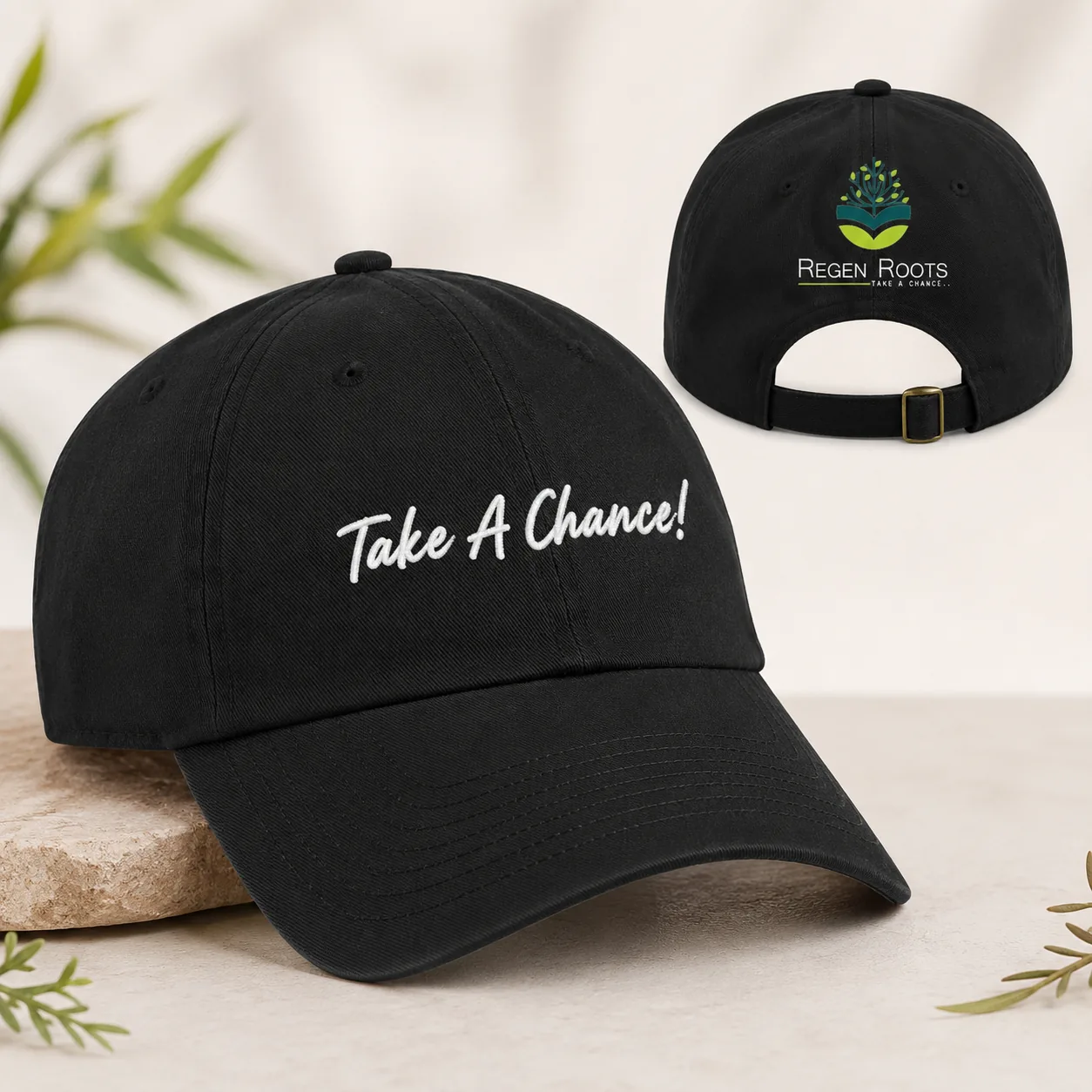 Black RegenRoots cap with Take A Chance embroidery and back logo